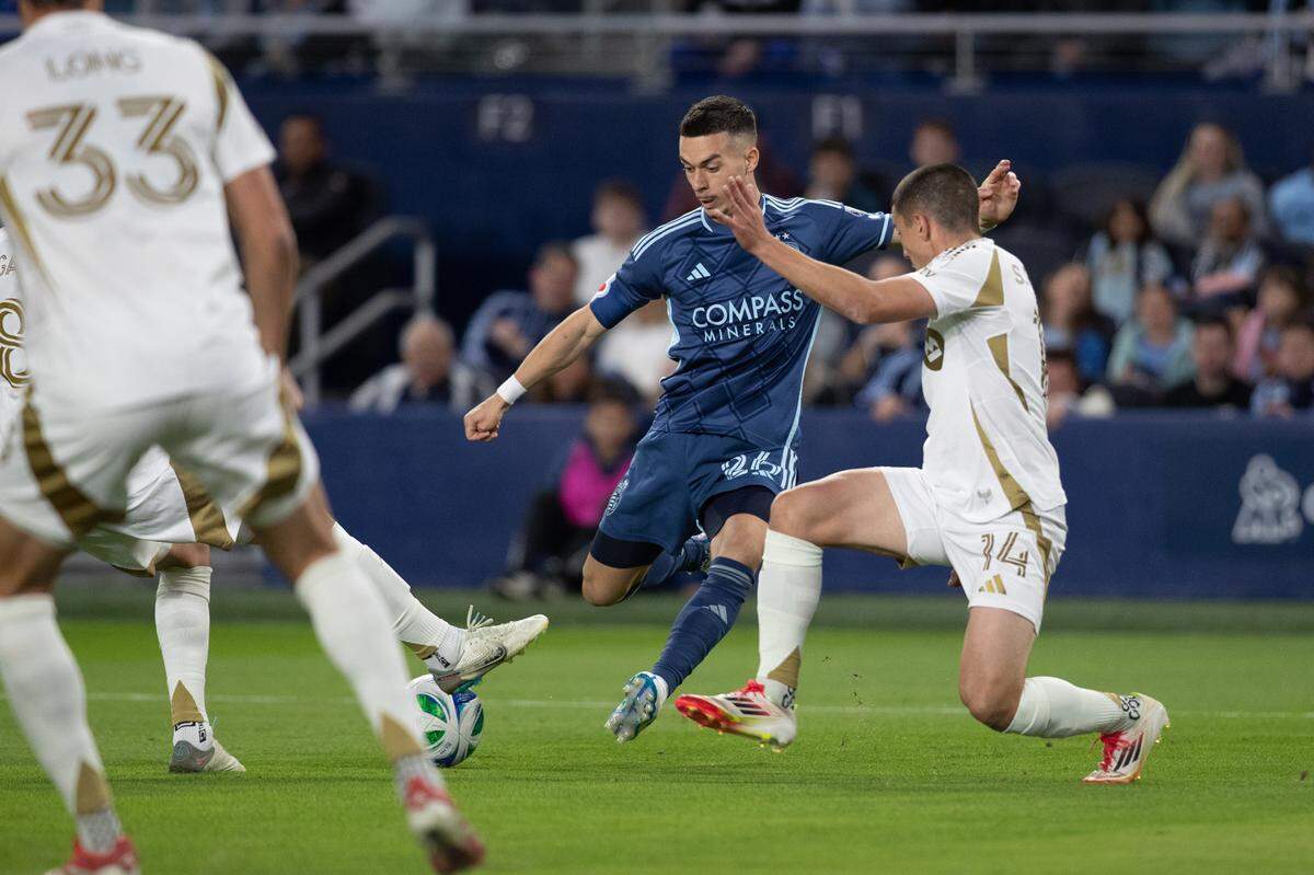 Sporting Kansas City midfielder Erik Thommy (25) attempts to kick the ball during the first half of the match at Children’s Mercy Park on March 22, 2025.