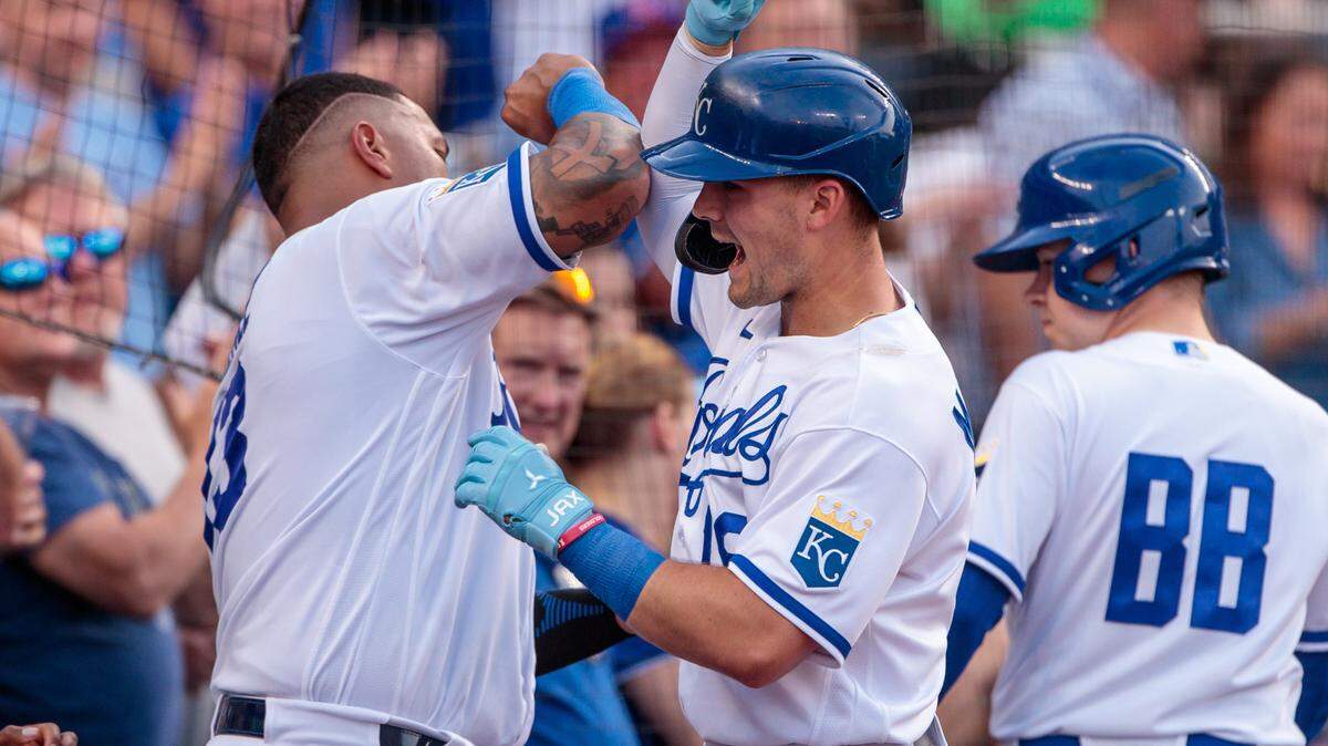 Royals catcher Salvador Perez, left, celebrates with second baseman Michael Massey, center, during the fourth inning of Wednesday’s game against the Chicago White Sox at Kauffman Stadium.