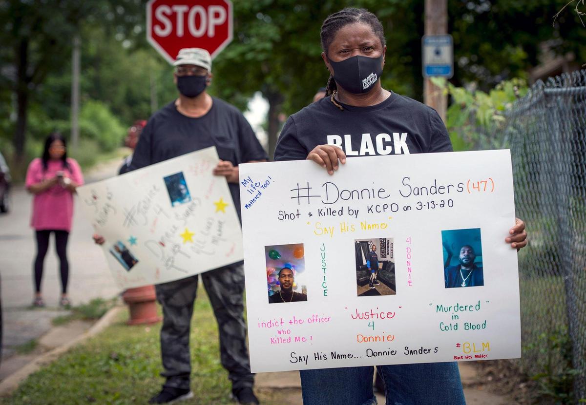 The family of Donnie Sanders, including sister, Youlanda Sanders, (right) and others gathered to talk about police brutality and seeking justice for Donnie, 47, who died after being shot by a Kansas City police officer in March. Donnie, who fled on foot after an attempted traffic stop, was shot near E. 52nd Street and Wabash Avenue on March 13 in Kansas City. He was unarmed.
