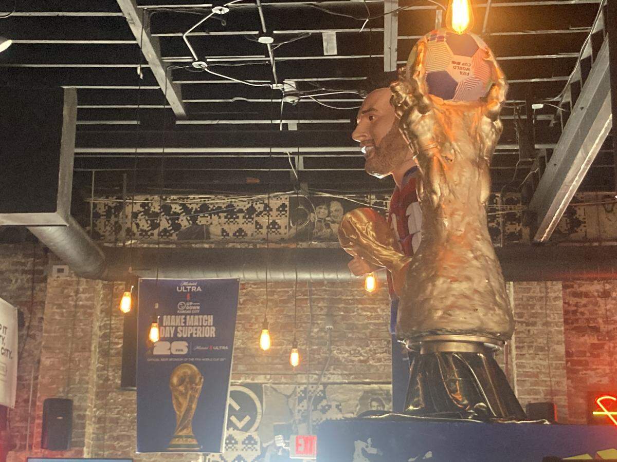 2026 FIFA World Cup banners and a rotating World Cup-like soccer trophy adorn the interior of Up-Down Arcade Bar in Kansas City, 101 Southwest Blvd.