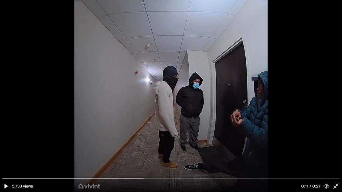 Surveillance video shows three men force open a downtown Kansas City apartment on Feb. 14, 2022.