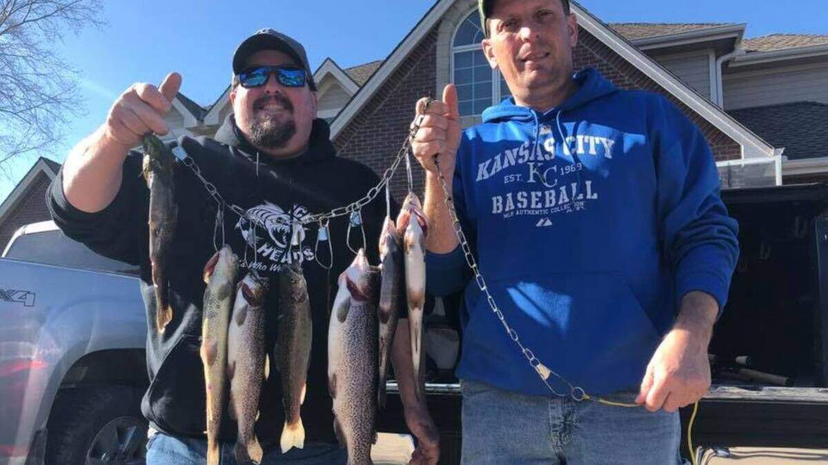 Neil and Richard Dublinske show off their catch from James A. Reed, where they caught on their limit of trout on rainbow colored Powerbait.