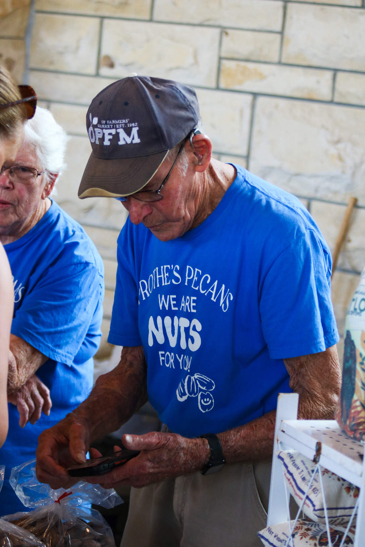 Leland Prothe sells pecans from his business Prothe’s Pecans at the Overland Park Farmer’s Market on June 6, 2026.