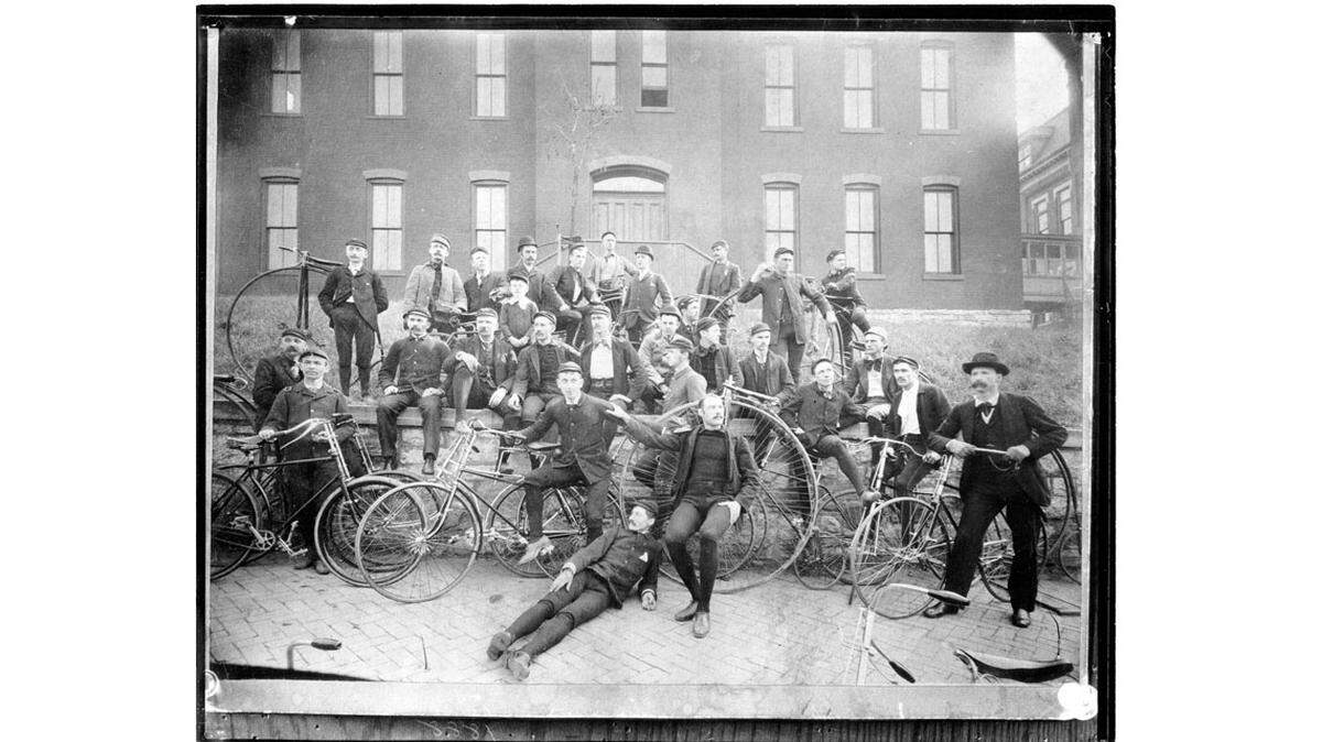 Members of the Kansas City Bicycle Club pose with their bikes. Note the safety bicycles and the high wheels. (General Photograph Collection, Missouri Valley Special Collections.)