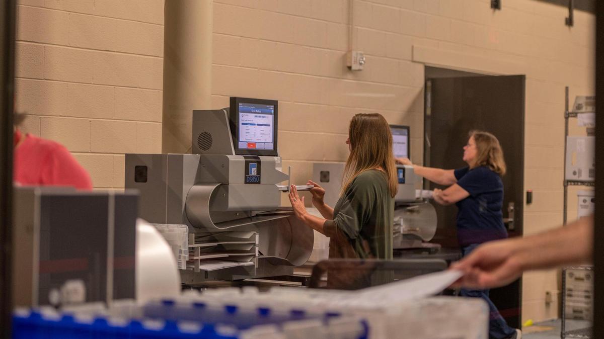 Election workers sort out voter ballots through a machine at the Johnson County Election Office on Tuesday, Aug. 16, 2022, in Olathe. Kansas’ largest counties will undergo a recount of ballots from the August 2, election in an attempt by Value Them Both supporters to overturn the state’s vote in favor of abortion rights.