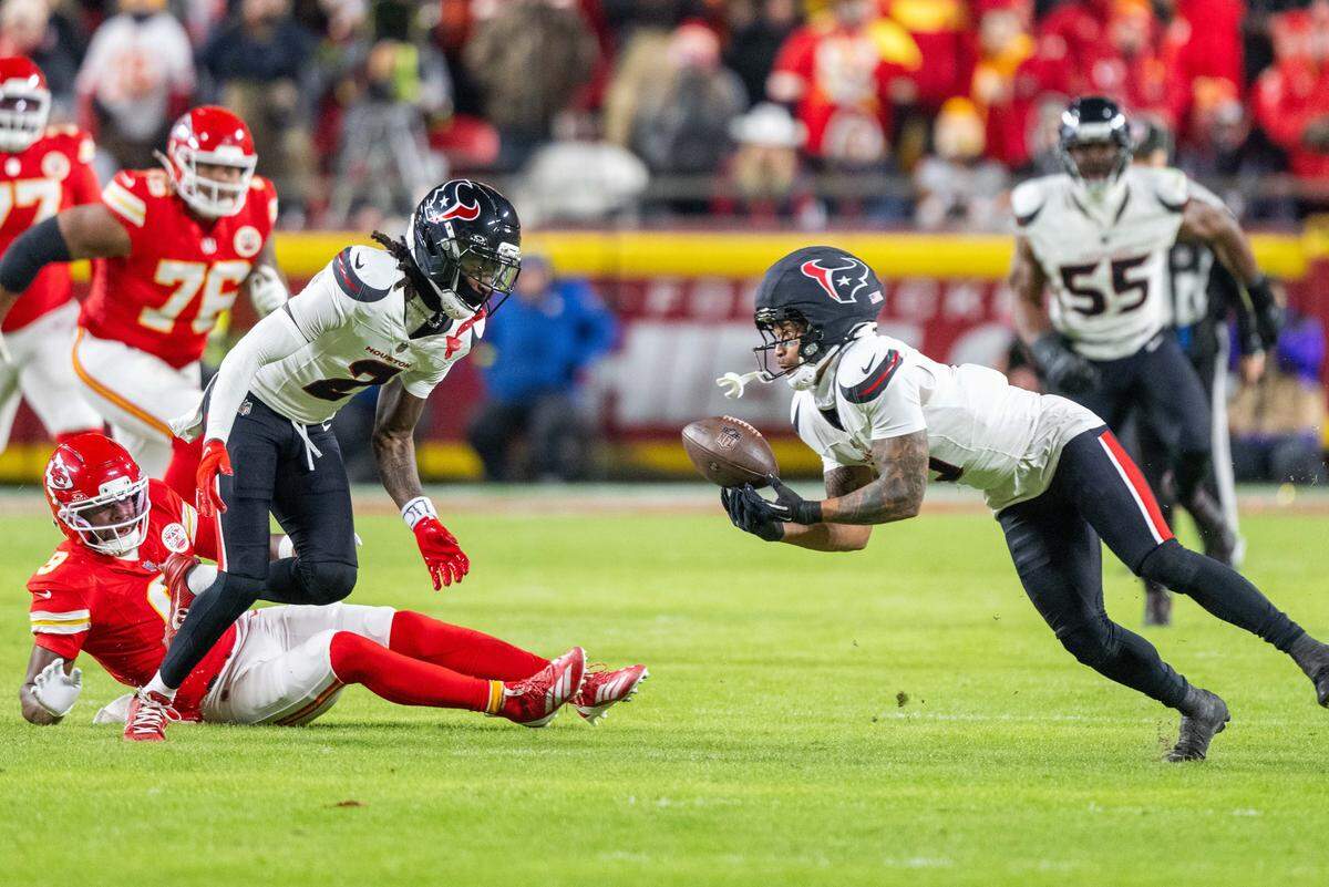 Houston Texans safety Jalen Pitre (No. 5) intercepts Chiefs quarterback Patrick Mahomes late in the first half of a Sunday, Dec. 7, 2025 NFL game at GEHA Field at Arrowhead Stadium in Kansas City.