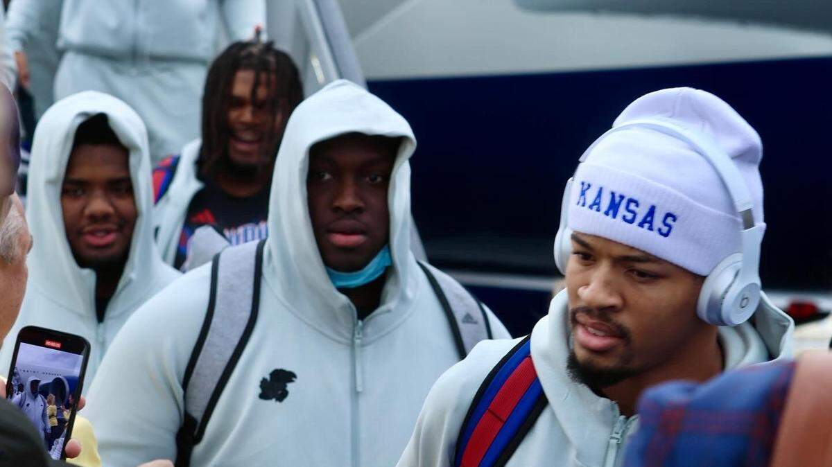 KU players disembark their plane in Phoenix on Friday ahead of Tuesday’s Guaranteed Rate Bowl.