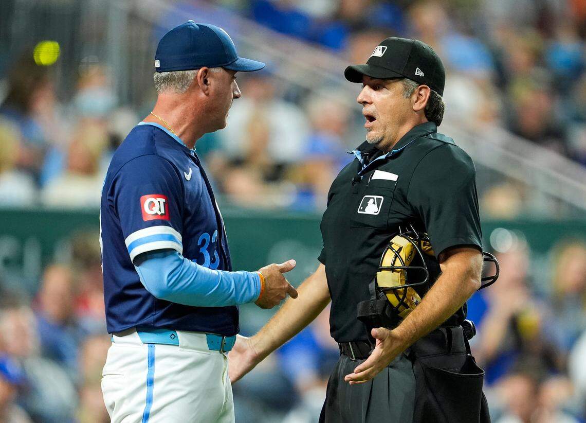 Kansas City Royals manager Matt Quatraro, left, talks with umpire James Hoye during the sixth inning of Friday night’s game against the San Francisco Giants at Kauffman Stadium.