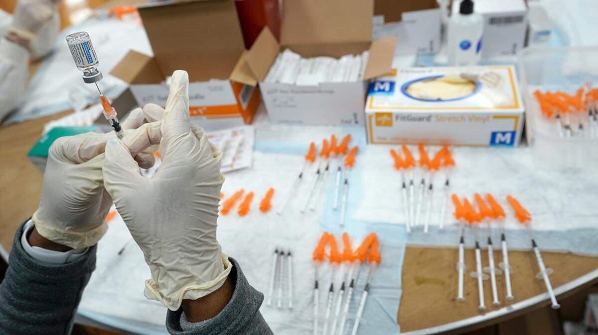 FILE - A Northwell Health registered nurse fills a syringe with a COVID-19 vaccine at a pop up vaccination site the Albanian Islamic Cultural Center, April 8, 2021, in the Staten Island borough of New York. The Food and Drug Administration on Thursday, June 30, 2022 recommended that COVID-19 booster shots be modified to better match more recent variants of the coronavirus. (AP Photo/Mary Altaffer, file)