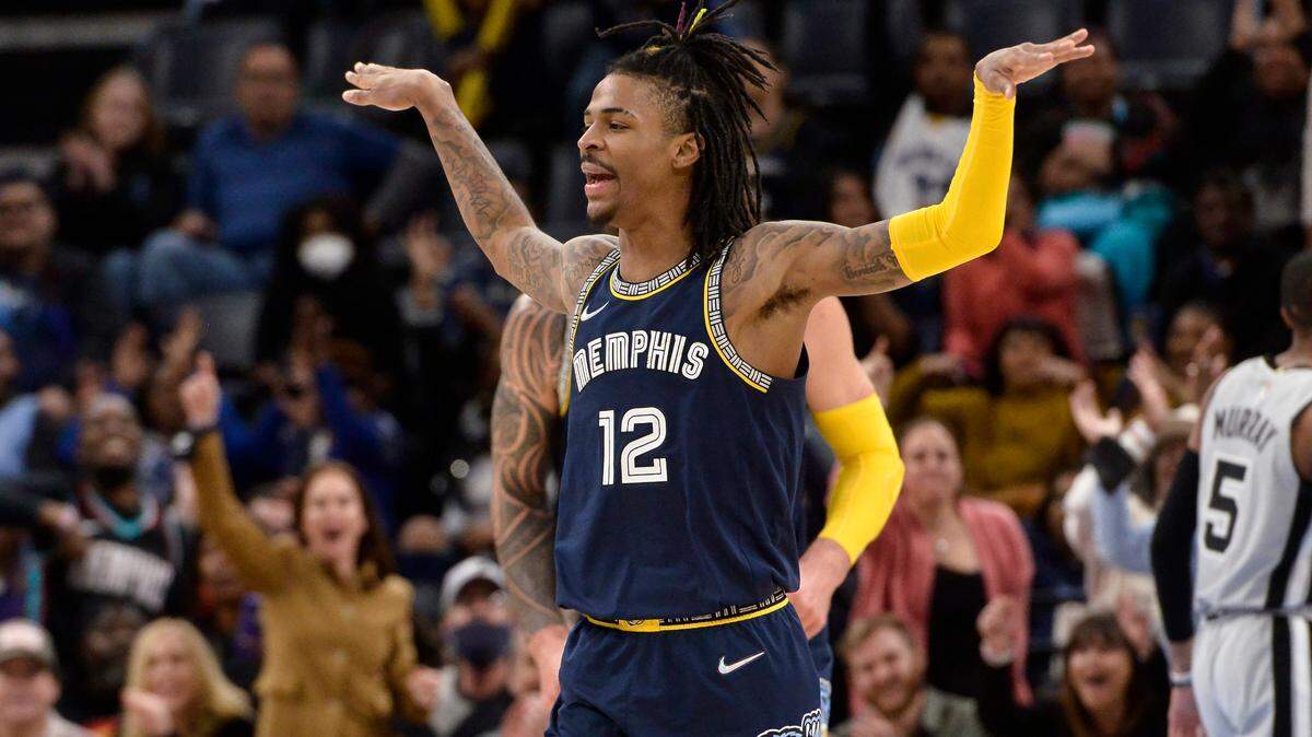 Memphis Grizzlies guard Ja Morant reacts during the first half of the team’s NBA basketball game against the San Antonio Spurs on Monday, Feb. 28, 2022, in Memphis, Tenn. (AP Photo/Brandon Dill)