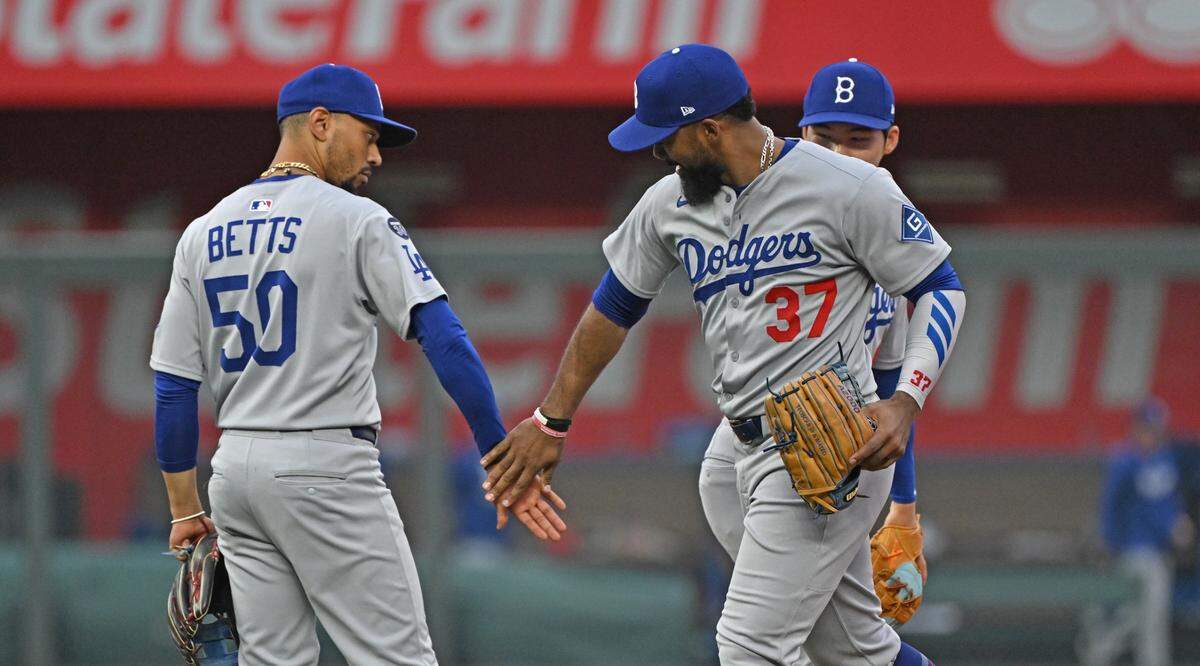 Dodgers infielder Mookie Betts, left, and right fielder Teoscar Hernandez celebrate a Sunday, June 29, 2025 win against the Royals at Kauffman Stadium in Kansas City.