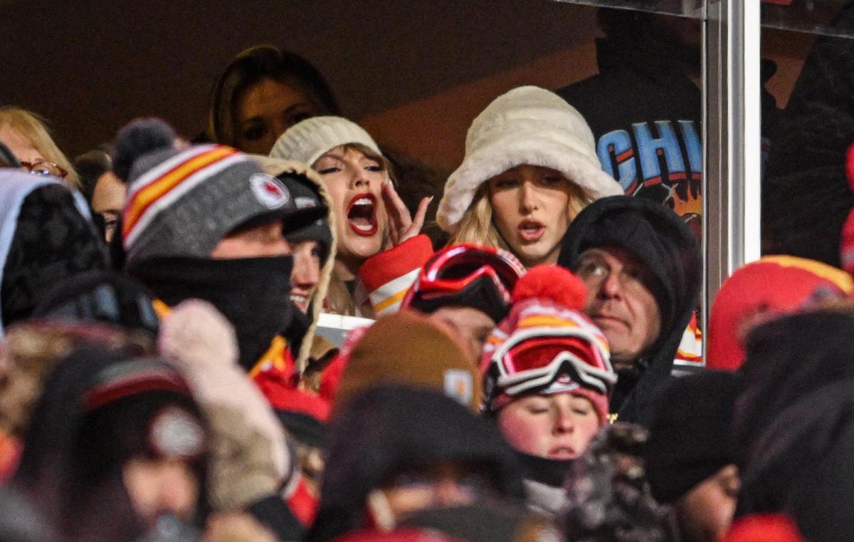 Pop star Taylor Swift yells while she watches the Kansas City Chiefs play the Miami Dolphins with Brittany Mahomes in a suite on Jan. 13, 2024, at GEHA Field at Arrowhead Stadium.