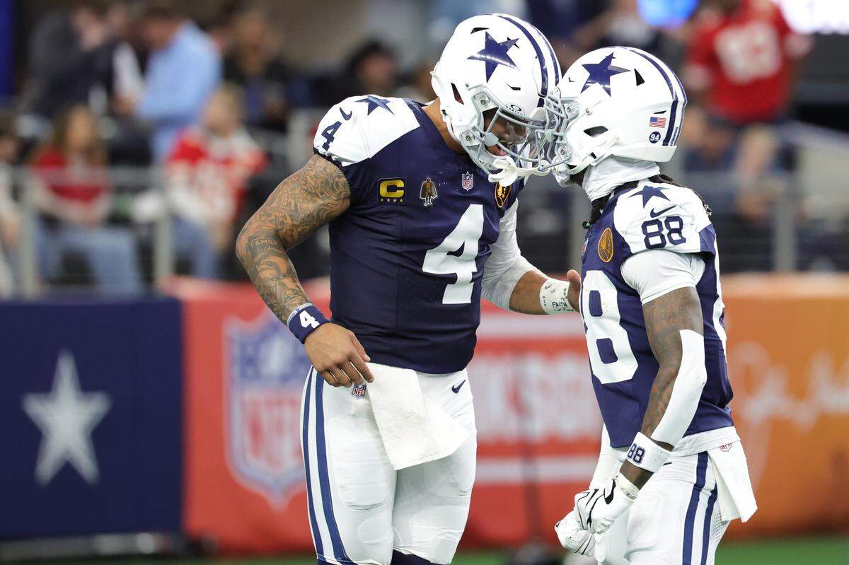 Dallas Cowboys quarterback Dak Prescott, left, and wide receiver CeeDee Lamb celebrate after connecting for a touchdown against the Kansas City Chiefs during an NFL Week 13 game at AT&T Stadium in Arlington, Texas on Thanksgiving Day, Thursday, Nov. 27, 2025.