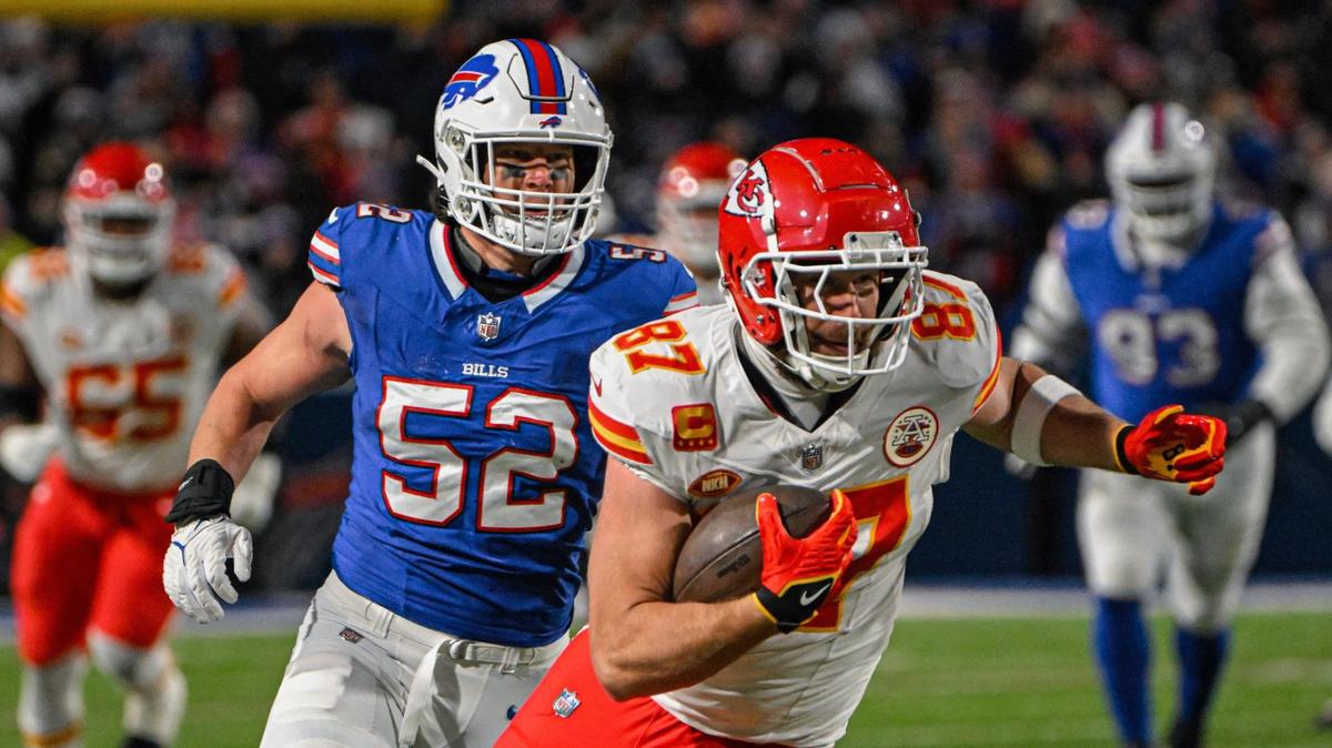 Kansas City Chiefs tight end Travis Kelce (87) makes a catch and gets some yardage past the defense of Buffalo Bills linebacker A.J. Klein (52) in the first half Sunday, Jan. 21, 2024, at Highmark Stadium in Orchard Park, New York.