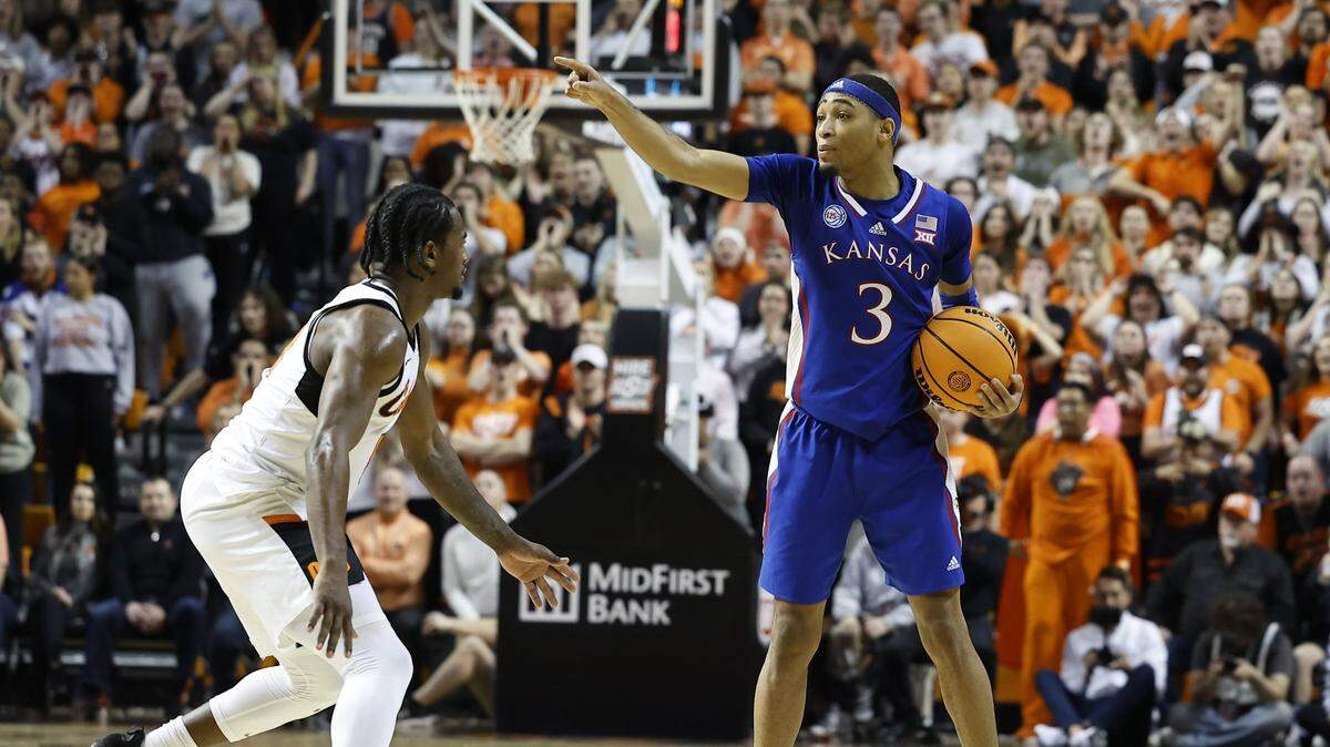 Kansas Jayhawks guard Dajuan Harris Jr. gestures to his team during a Big 12 men’s basketball game in the 2022-23 regular season.
