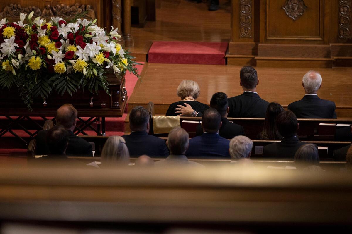 Linda, Len Dawson’s wife, was comforted during a memorial service for her husband at Country Club Christian Church on Friday, Sep. 16, 2022, in Kansas City.