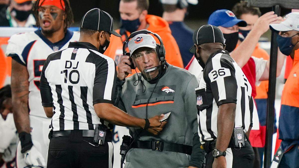 Denver Broncos head coach Vic Fangio talks to officials during the first half of an NFL football game against the New York Jets Thursday, Oct. 1, 2020, in East Rutherford, N.J. (AP Photo/John Minchillo)