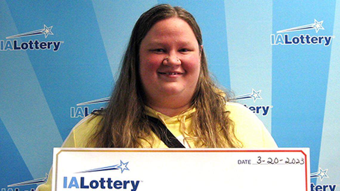 Amber Finger with her oversized check.