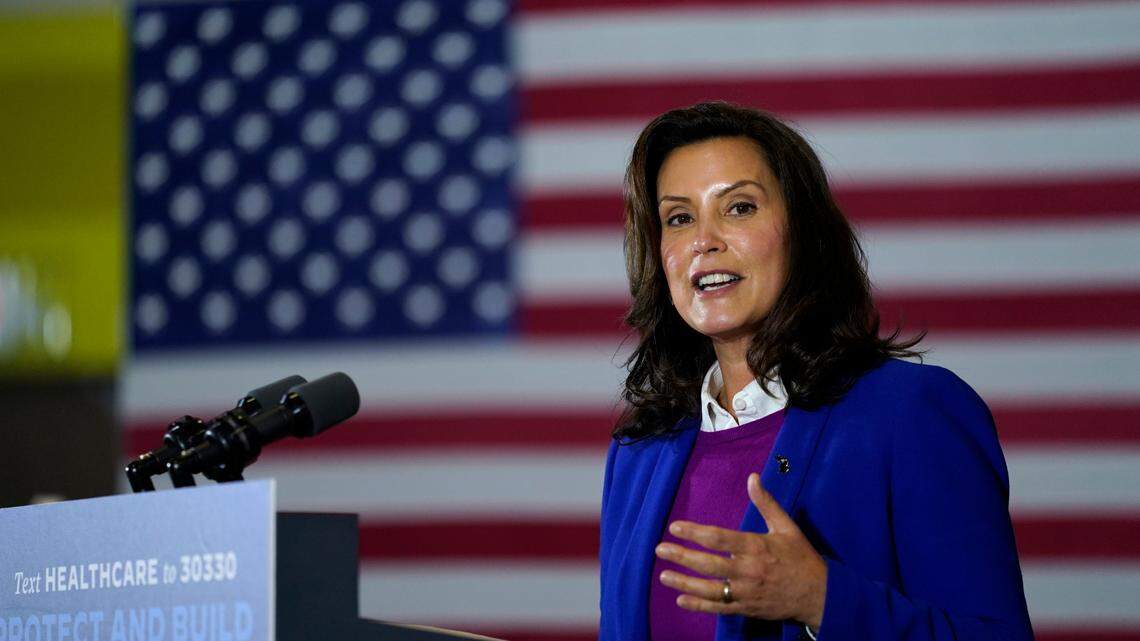 File-This Oct. 16, 2020, file photo shows Michigan Gov. Gretchen Whitmer speaking during an event with Democratic presidential candidate former Vice President Joe Biden at Beech Woods Recreation Center, in Southfield, Mich. Whitmer’s administration on Sunday, Nov. 15, 2020, ordered high schools and colleges to stop in-person classes, closed restaurants to indoor dining and suspended organized sports — including the football playoffs — in a bid to curb the state’s spiking coronavirus cases. The restrictions will begin Wednesday and last three weeks. (AP Photo/Carolyn Kaster, File)