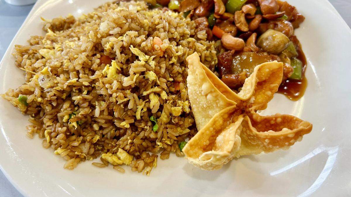 A dish of chicken with cashew, fried rice and crab Rangoon is a favorite at Sacred Wok, which opened in Overland Park last Thursday.