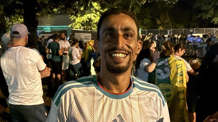 Enthusiastic World Cup soccer fans greet Algeria’s national team in Lawrence