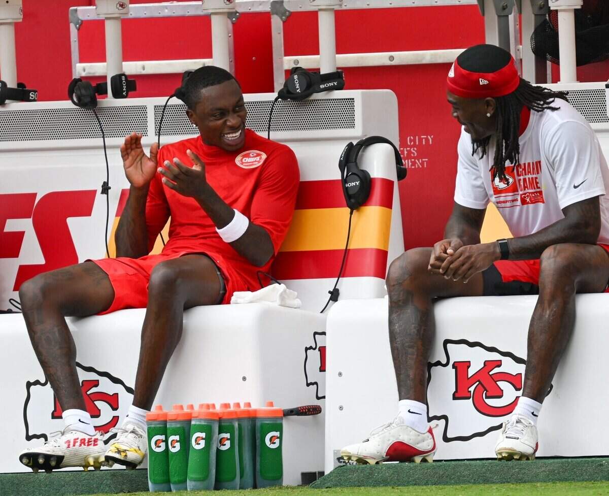 Kansas City Chiefs wide receiver Xavier Worthy (1) and Kansas City Chiefs wide receiver Rashee Rice (4) laugh on the bench during team warmups ahead of the Kansas City Chiefs preseason game against the Los Angeles Rams at Arrowhead Stadium in Kansas City on Aug. 15, 2026.