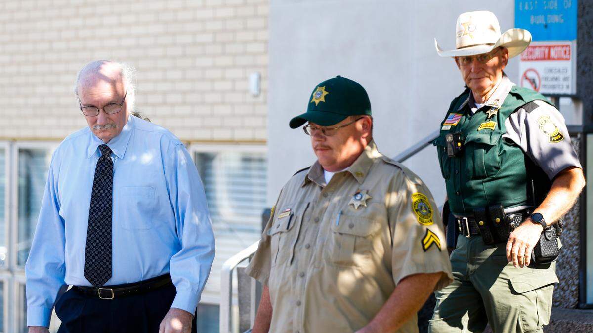 James Phelps (left) is escorted by two Dallas County Sheriff’s deputies as he leaves the Dallas County Courthouse after waiving his right to a preliminary hearing on charges he killed Cassidy Rainwater.