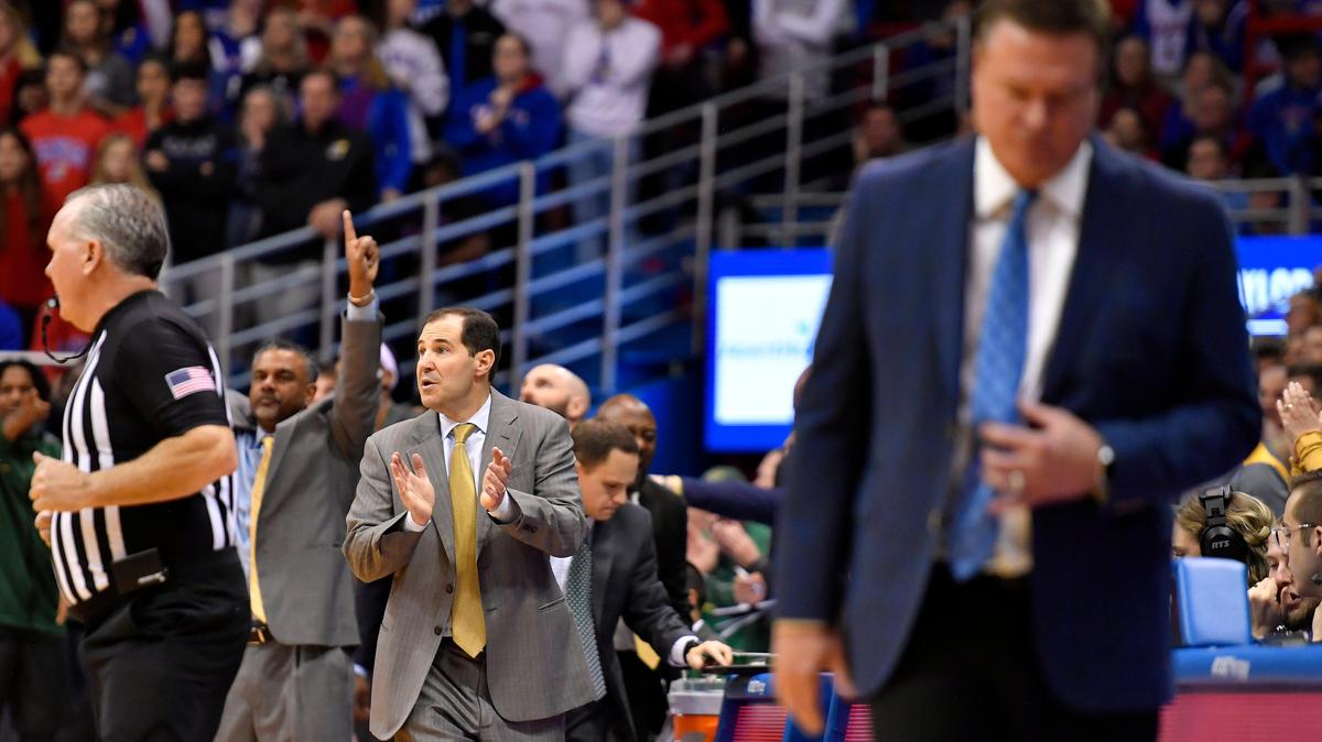 Baylor coach Scott Drew got his first win at Allen Fieldhouse Saturday, when his Bears took down Bill Self, right, and the Jayhawks, 76-55.