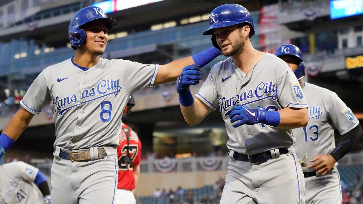 Kansas City Royals’ Andrew Benintendi (right) is congratulated by Nicky Lopez (8) following Benintendi’s three-run home run off Minnesota Twins pitcher Griffin Jax during the first inning on Friday, Sept. 10, 2021, in Minneapolis.