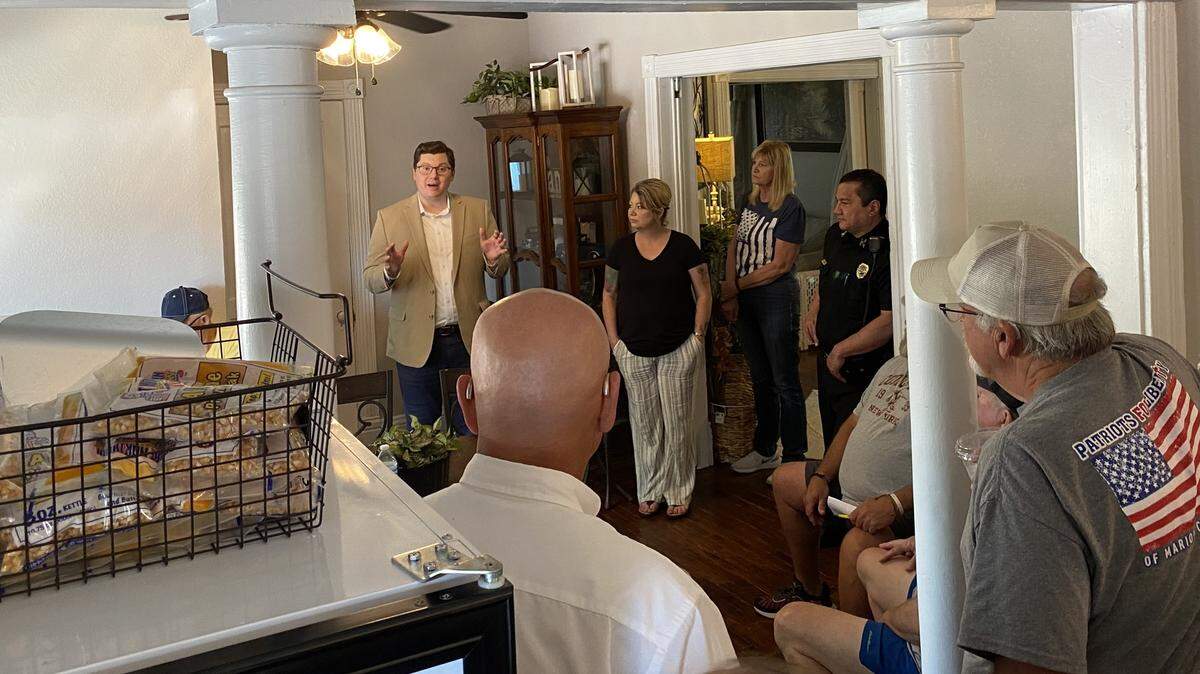 Marion restaurateur Kari Newell (center) hosted U.S. Rep Jake LaTurner at her coffee shop in early August. During the meet-and-greet, she asked that two journalists with the Marion County Record be escorted out. The Record’s newsroom was raided by police days later.