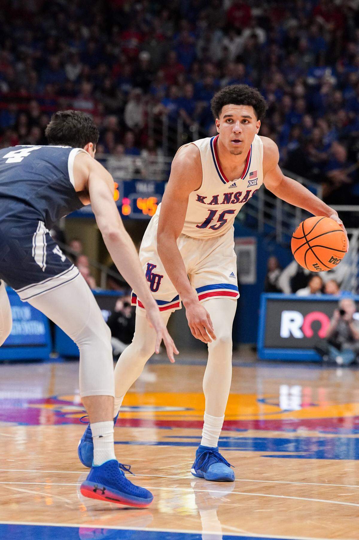 Kansas Jayhawks guard Kevin McCullar Jr. dribbles the ball as Yale Bulldogs guard John Poulakidas defends during Friday night’s game at Allen Fieldhouse in Lawrence, Kan.