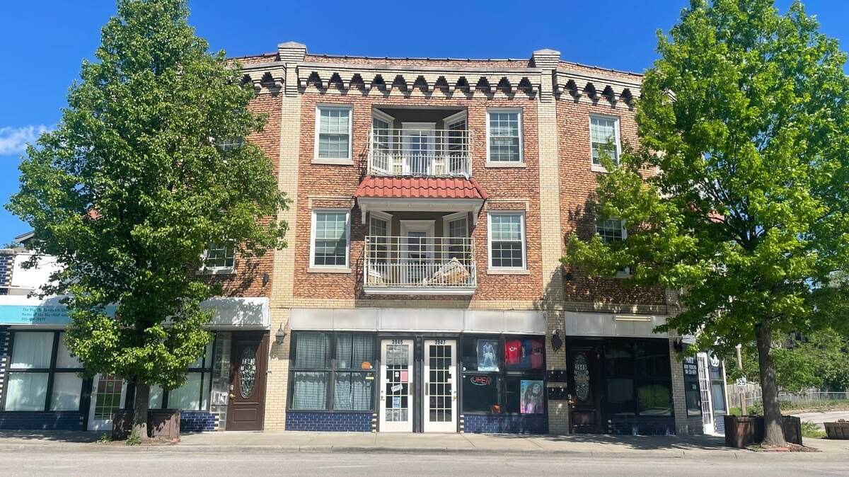 A mixed-use building near 38th Street and Troost Avenue, formerly owned by Oliver Abnos. A court-appointed receiver is liquidating Abnos’ assets after he failed to pay a $2 million judgment awarded against him in 2021.