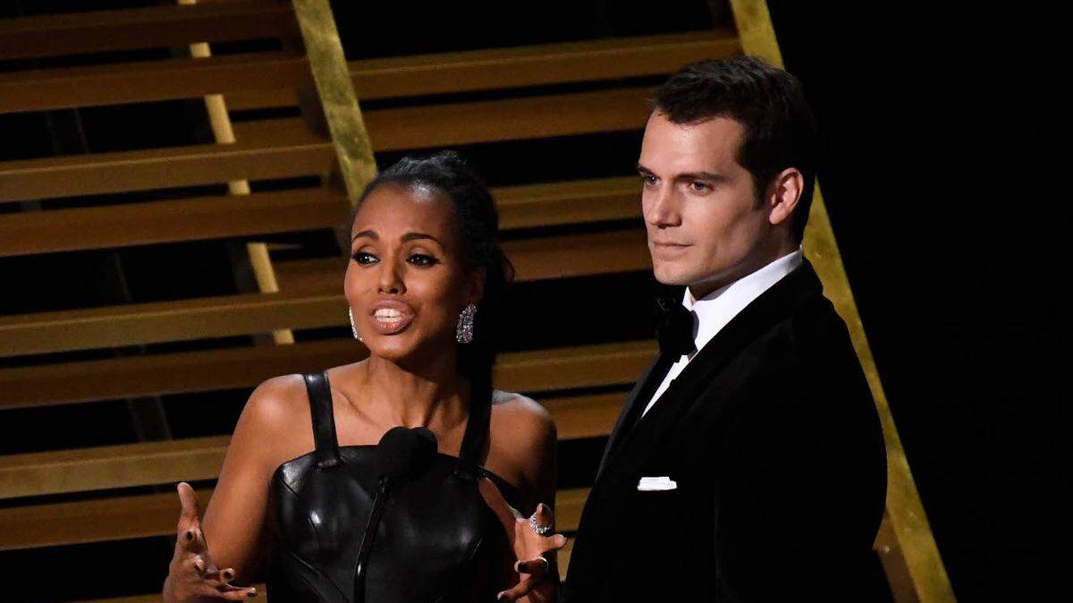 Kerry Washington and Henry Cavill speak onstage during the 88th annual Academy Awards at the Dolby Theater.