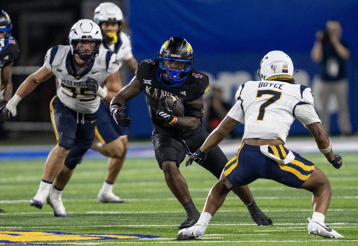 Kansas Jayhawks running back Leshon Williams (4) runs for a 62-yard touchdown in the second half against the West Virginia Mountaineers at David Booth Kansas Memorial Stadium on Saturday, Sept. 20, 2025, in Lawrence.