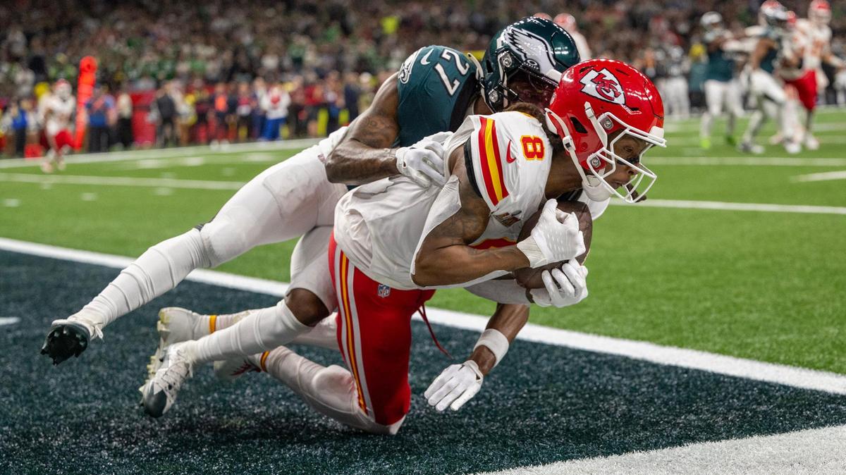 Kansas City Chiefs wide receiver DeAndre Hopkins (8) is tackled by Philadelphia Eagles cornerback Quinyon Mitchell (27) as he scores a touchdown in the second half in the Super Bowl LIX on Sunday, Feb. 9, 2025, in New Orleans.