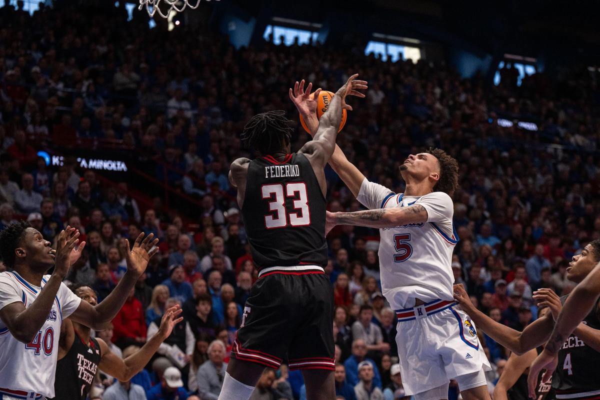 Kansas Jayhawks guard Zeke Mayo gets a shot blocked by Texas Tech Red Raiders forward Federiko Federiko in the first half on Saturday, March 1, 2025, at Allen Fieldhouse.