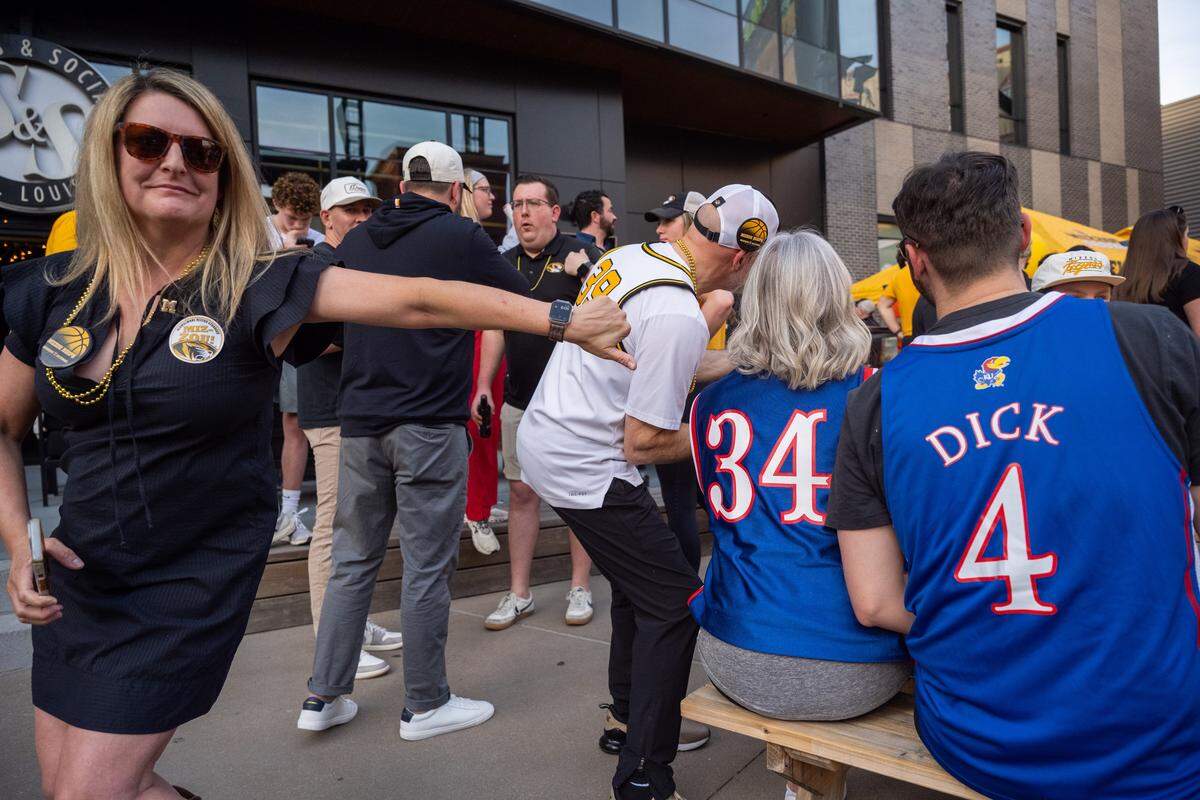 Justa Dahl gives a playful thumbs down to Kansas fans at the Mizzou Spirit Rally at Ballpark Village on Thursday, March 19, 2026, in St. Louis. The Missouri Tigers faced off against the Miami Hurricanes in the first round of the NCAA Men's Basketball Tournament in St. Louis.