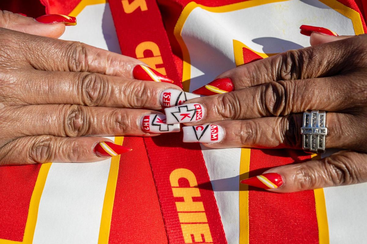 Victoria Klausing, of North Kansas City, showcases her Kansas City Chiefs-themed nails on Saturday, Feb. 10, 2024, in Las Vegas.