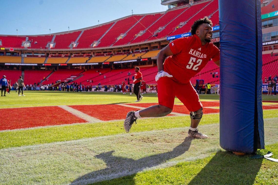 Kansas Jayhawks defensive tackle D.J. Withers (52) warms up before the team takes on the Colorado Buffaloes at GEHA Field at Arrowhead Stadium on Saturday, Nov. 23, 2024, in Kansas City.