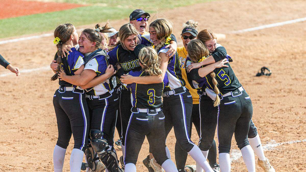 Kearney celebrates after beating Helias Catholic to win the Missouri Class 4 girls softball championship on Friday at the Killian Softball Complex in Springfield.