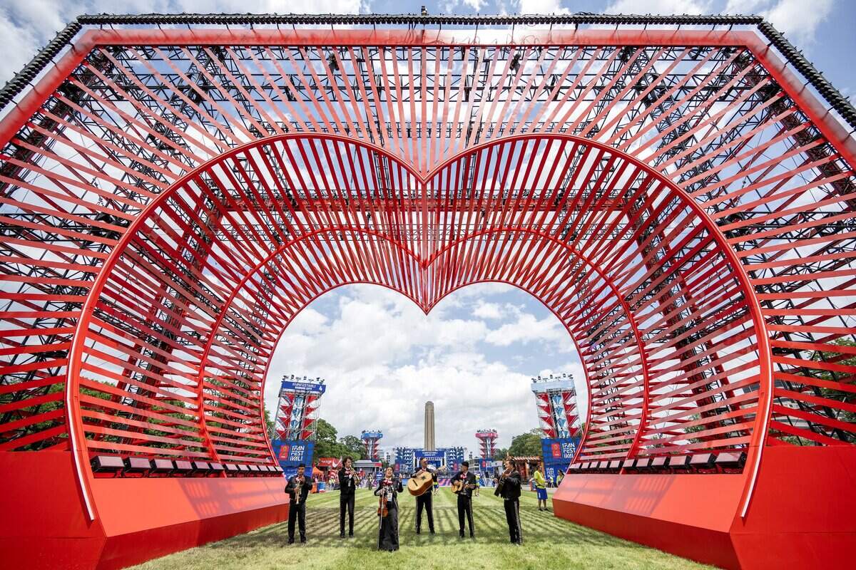Members of Naranjachi Los Reales de Kansas City perform for visitors near the Heart of America sculpture during the FIFA Fan Festival on Thursday, June 11, 2026, in Kansas City.