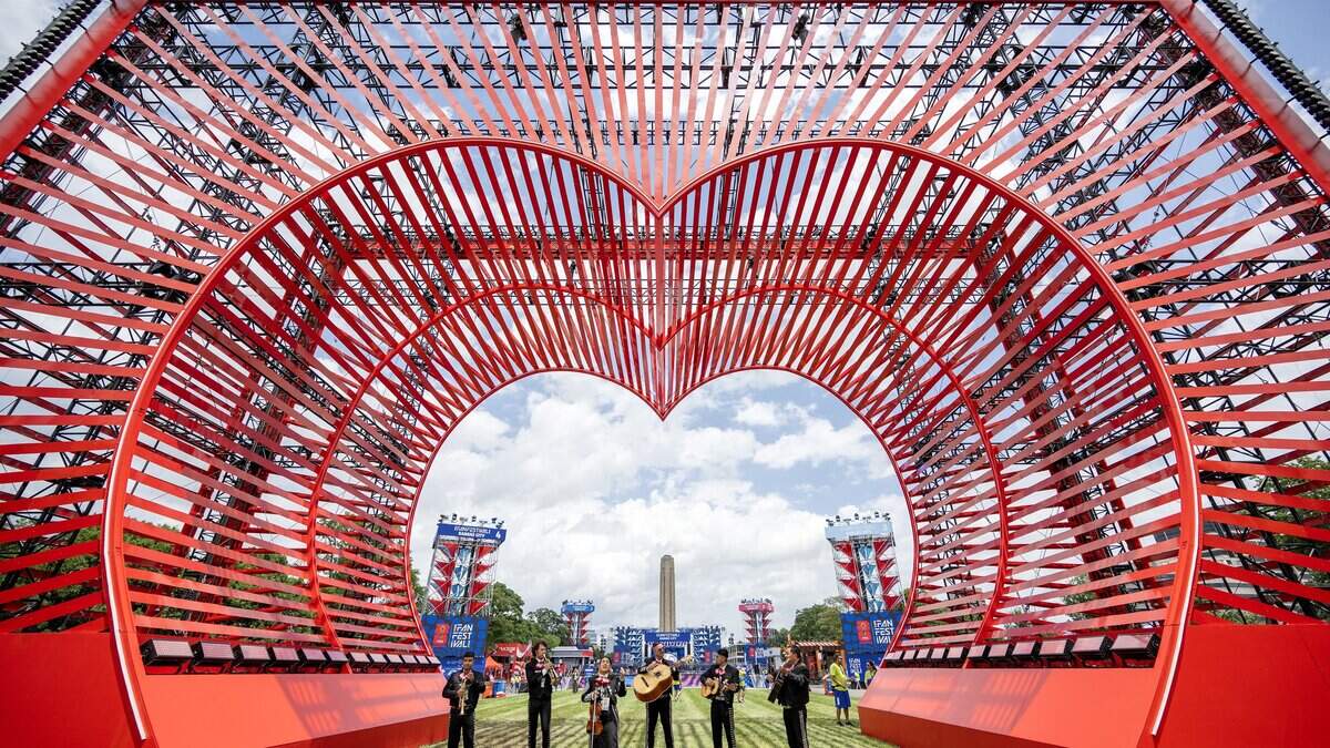 Members of Naranjachi Los Reales de Kansas City perform for visitors near the Heart of America sculpture during the FIFA Fan Festival on Thursday, June 11, 2026, in Kansas City.