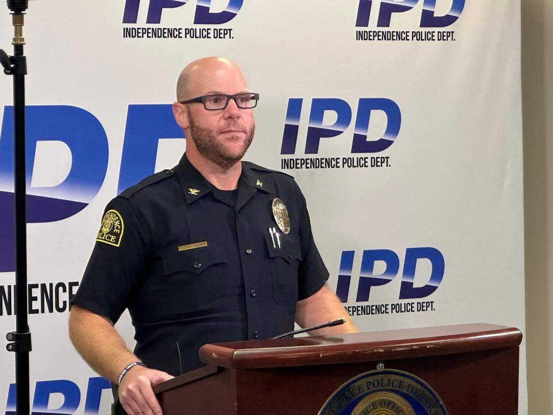 Independence police chief Adam Dustman fields questions from the media the day after an officer-involved shooting resulted in the deaths of a woman and child. 