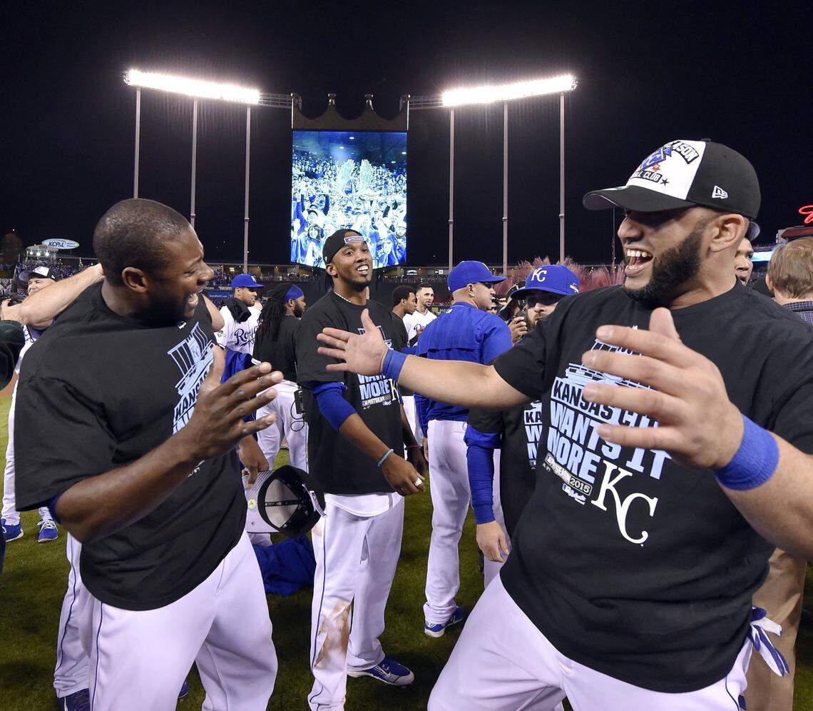 Kansas City Royals center fielder Lorenzo Cain, left, shortstop Alcides Escobar, center, and designated hitter Kendrys Morales ce;ebrated on the field after defeating the Houston Astros 7-2 after Wednesday’s ALDS baseball game on October 14, 2015 at Kauffman Stadium in Kansas City, Mo.