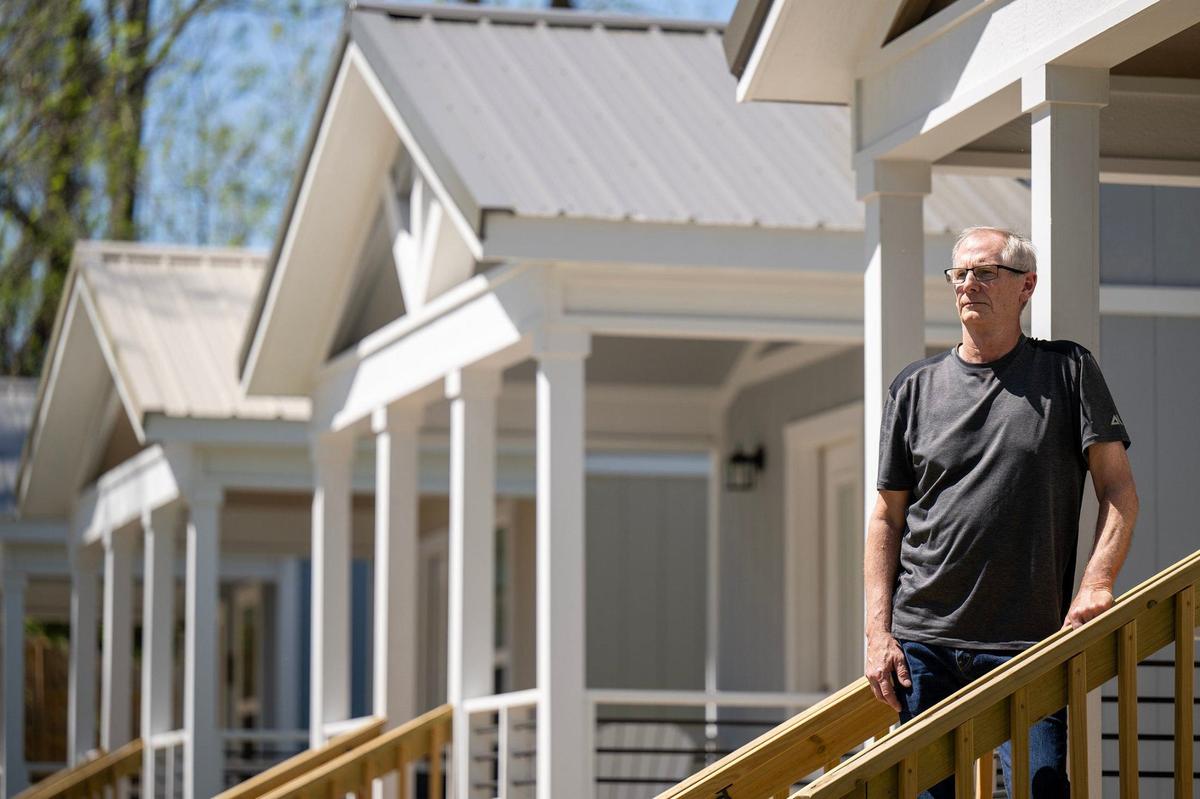 Phil Jorgenson, a longtime volunteer for Uplift, now secretary of Eden Village of Kansas City paused during a tour of the tiny homes.