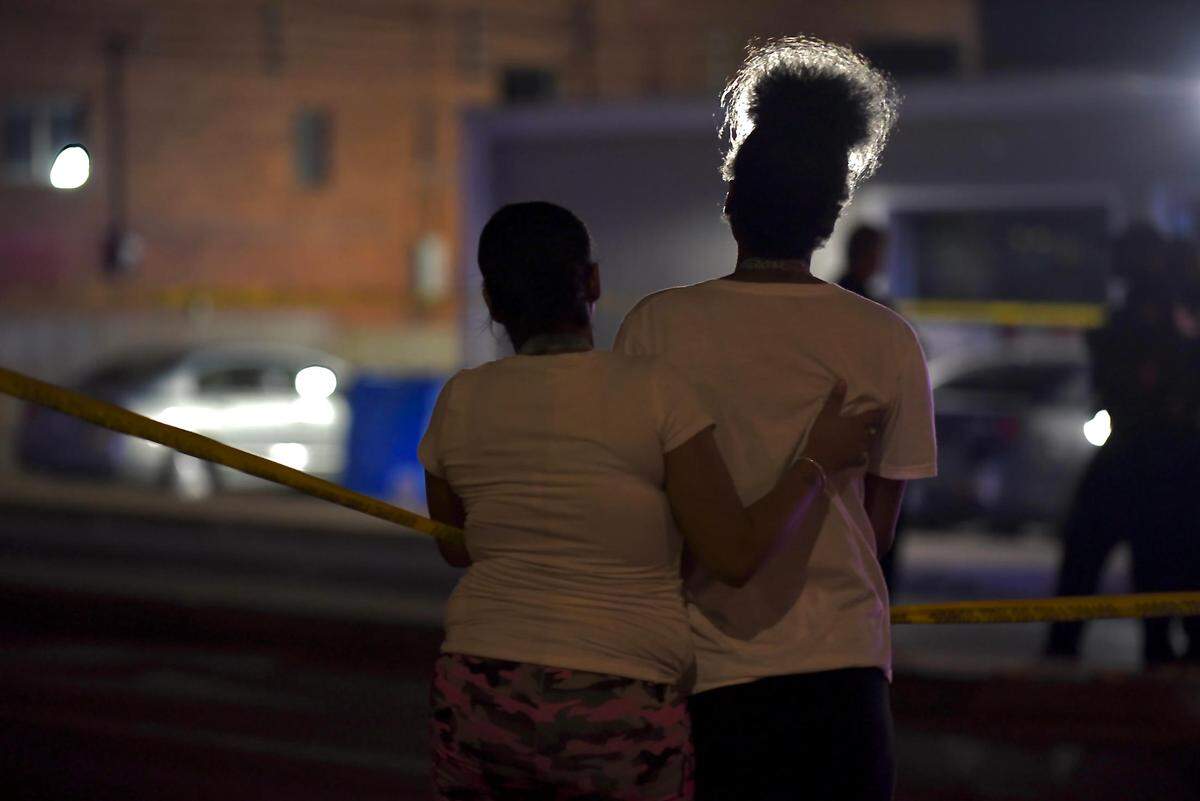 A teenager was fatally shot about 8:30 p.m. Tuesday in the area of the Raytown Plaza shopping center, Raytown police said. Two other people were injured. Hours after the shooting, at least two dozen people remained outside the police tape comforting one another.