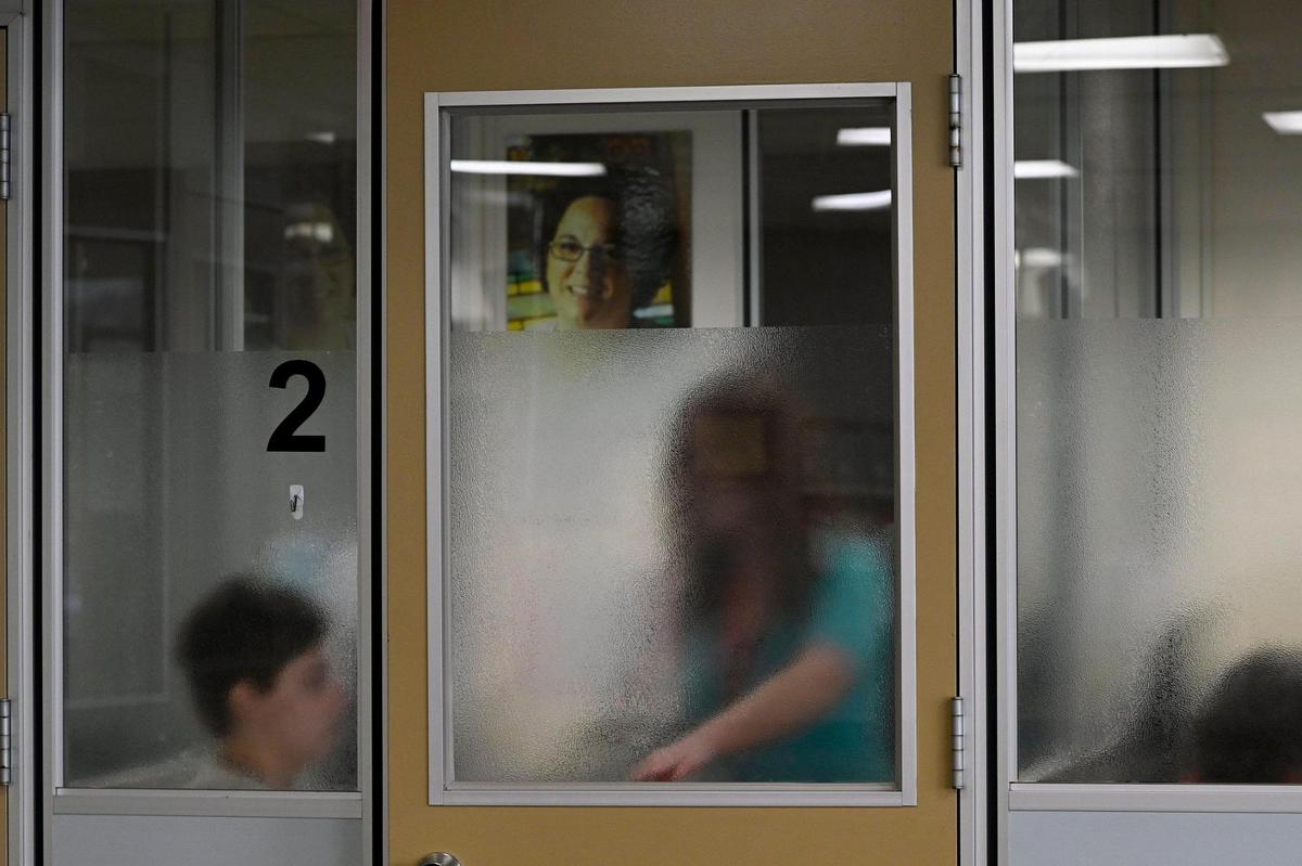 Natalie Wallington, left, a service desk reporter for The Kansas City Star, was screened privately before being allowed to donated blood for the first time at the Community Blood Center on Tuesday, Jan. 10, 2023, in Kansas City.