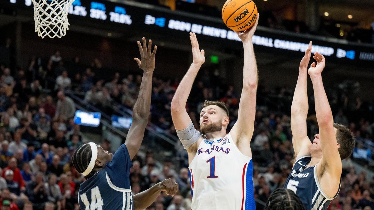 Kansas Jayhawks center Hunter Dickinson (1) shoots over Samford Bulldogs forward Achor Achor (14) during a men’s college basketball game in the first round of the NCAA Tournament on Thursday, March 21, 2024, in Salt Lake City, Utah.