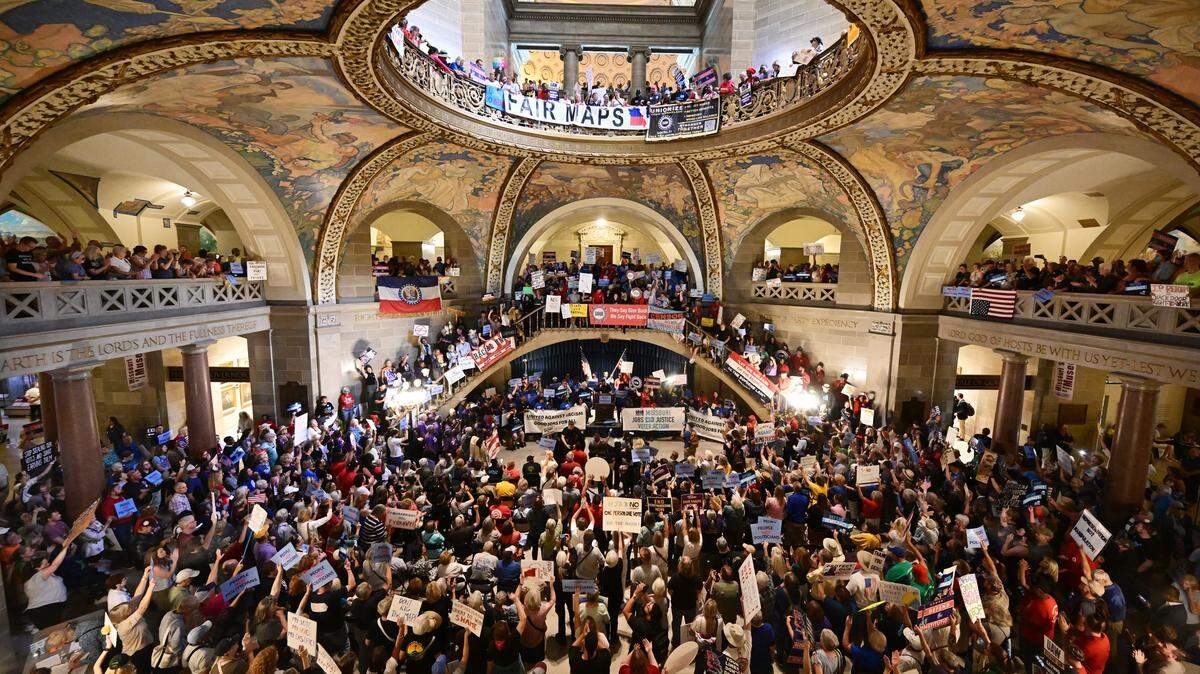 People gather at the Missouri statehouse in Jefferson City on Wednesday, Sept. 10, 2025, to protest the legislature's efforts to change the state's congressional district maps. The proposed change would divide Kansas City into districts that would include vast rural areas of the state.