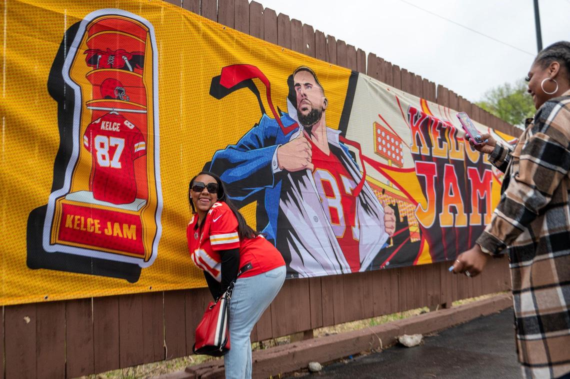 Keyanna Carter poses for a photo next to a Travis Kelce banner while attending Kelce Jam at the Azura Amphitheater on Friday, April 28, 2023, in Bonner Springs.
